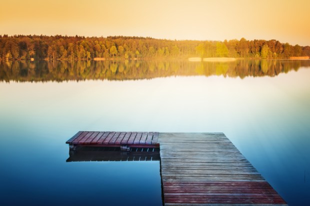 Empty footbridge over the lake