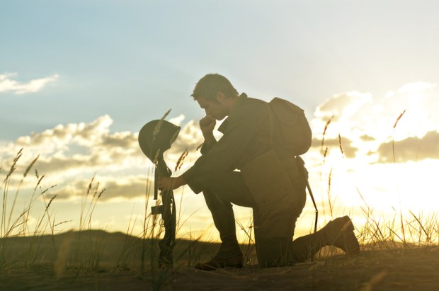 Soldier Praying for a Fallen Friend